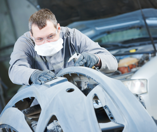 an auto professional using nitrile gloves